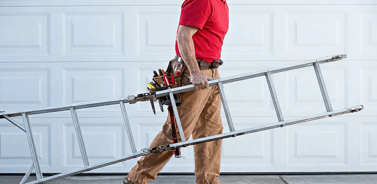 Garage door repair technician arriving with tools and ladder in San Jose, CA